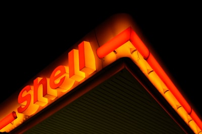 Shell petrol station sign lit up at night